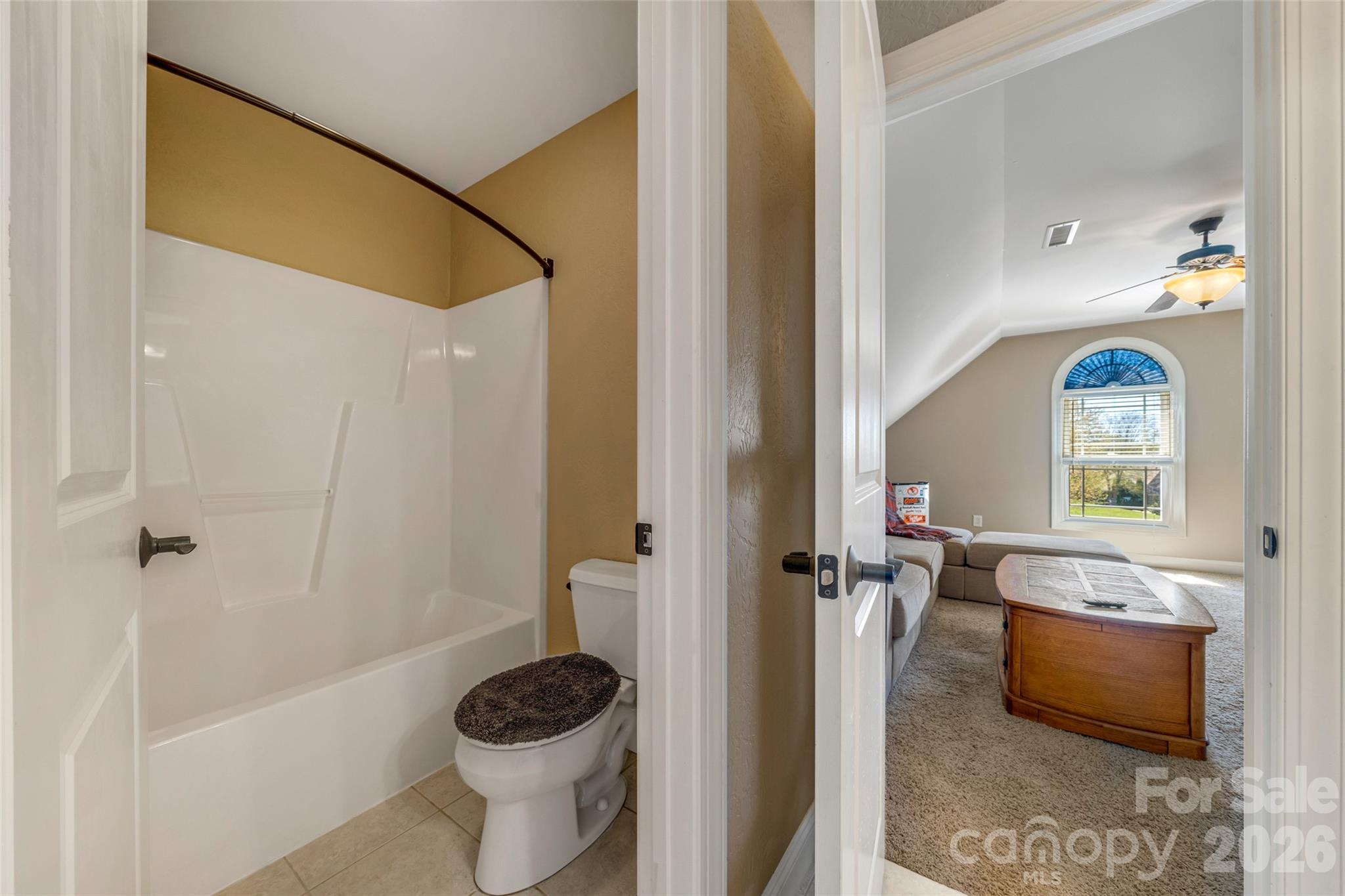 5873 Bakers Point Hickory, NC 28602 - Photo 31 of 48 a bathroom with a granite countertop sink a toilet and shower