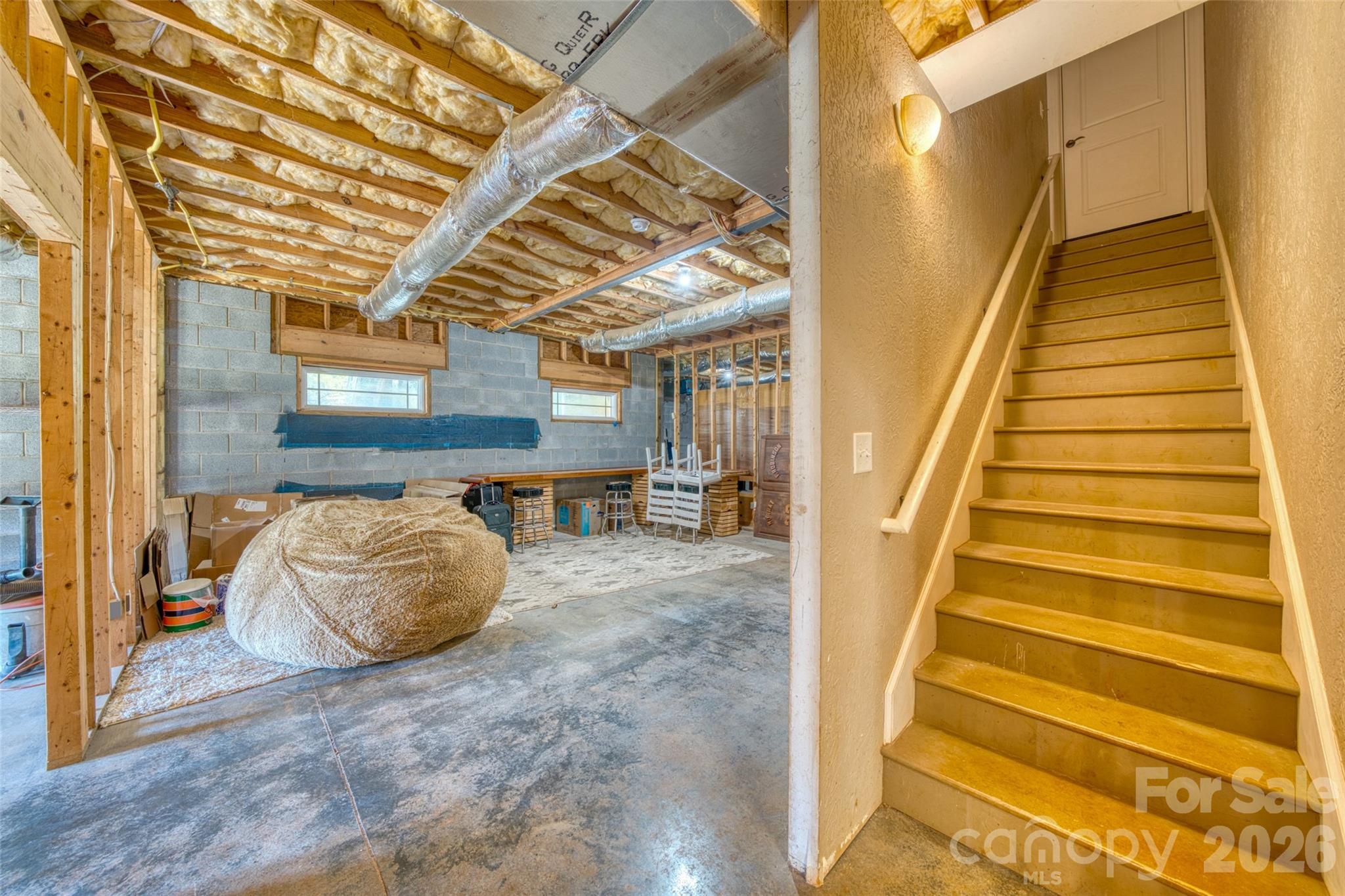 5873 Bakers Point Hickory, NC 28602 - Photo 34 of 48 a room with stairs and a rug