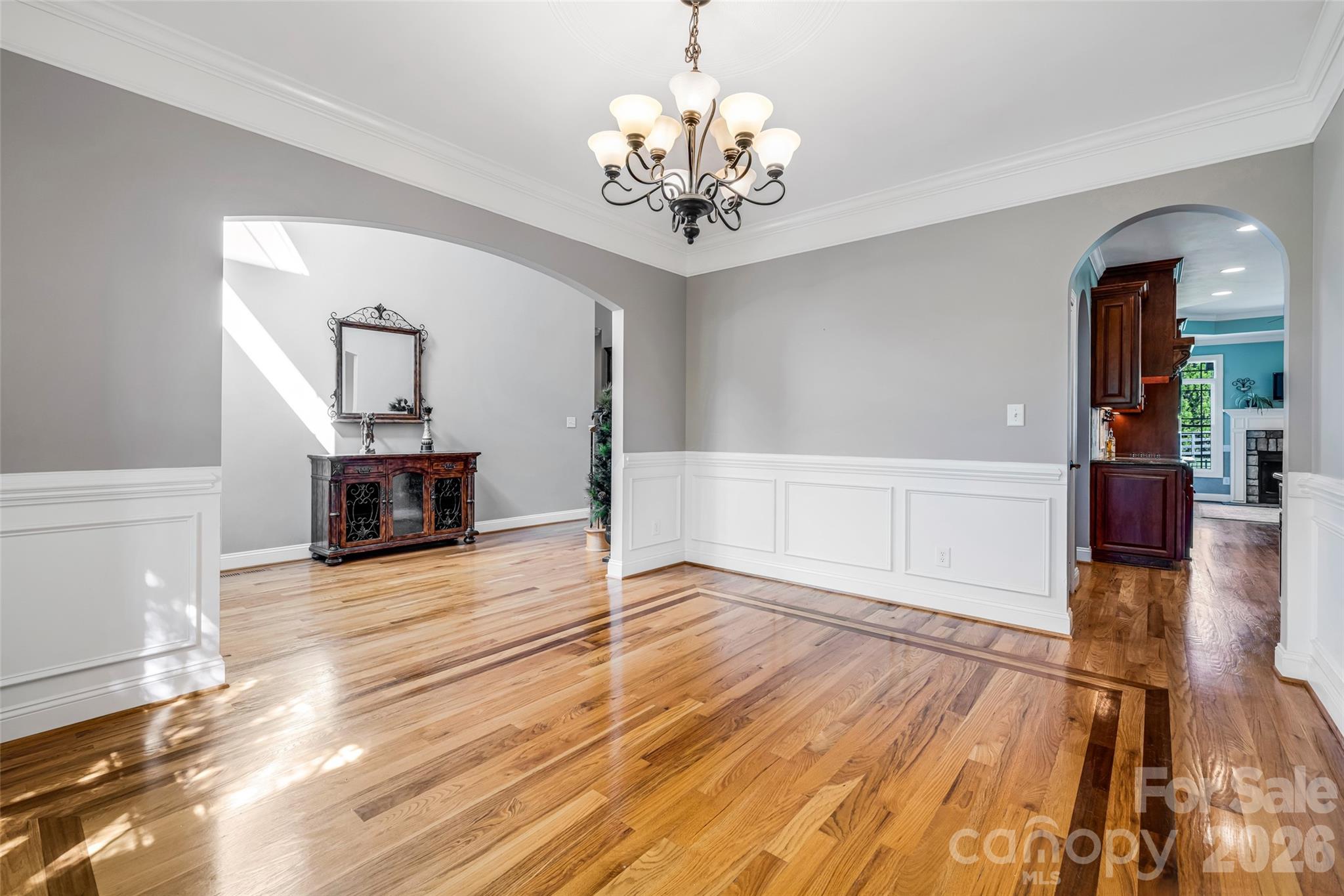 5873 Bakers Point Hickory, NC 28602 - Photo 7 of 48 a view of a livingroom with wooden floor and a chandelier