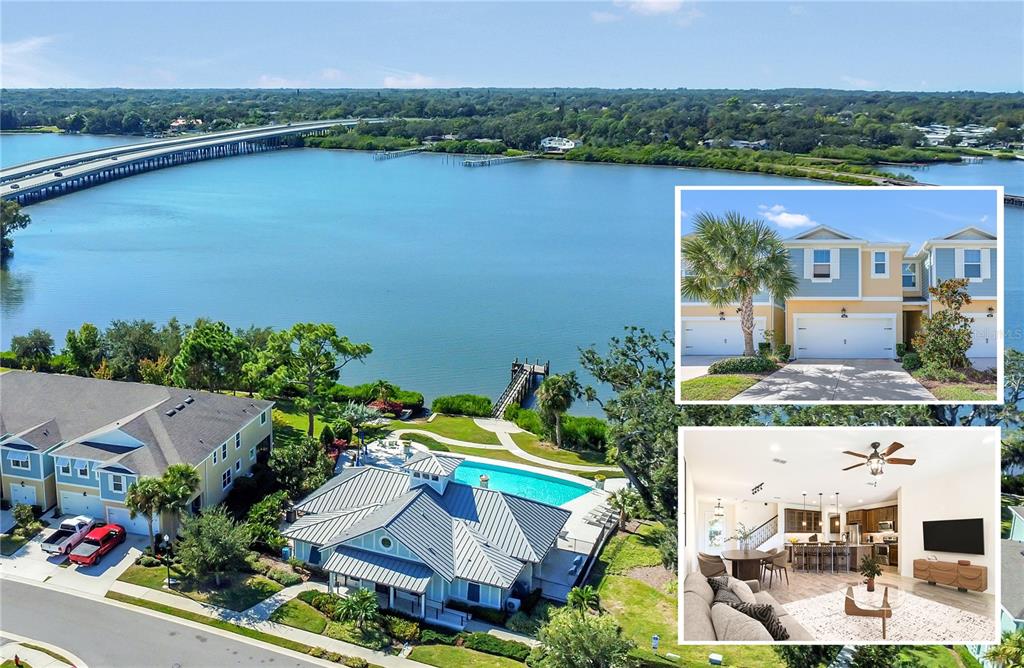 an aerial view of a house with outdoor space and lake view