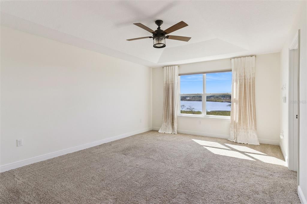 9009 Palm Key Avenue Oldsmar, FL 34677 - Photo 16 of 43 a view of a livingroom with a ceiling fan and window