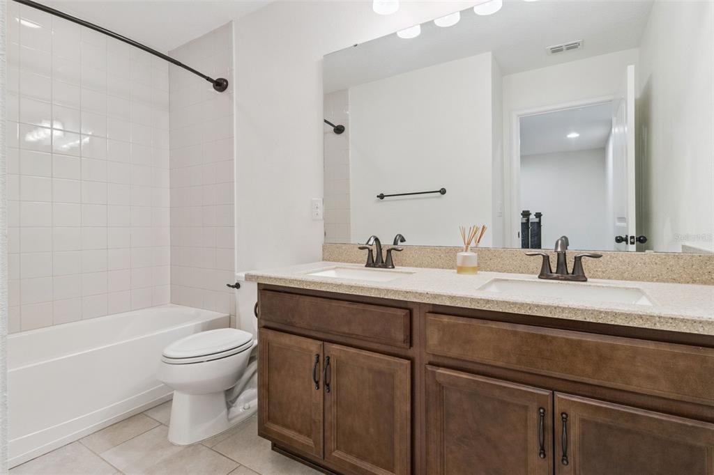9009 Palm Key Avenue Oldsmar, FL 34677 - Photo 26 of 43 a bathroom with a sink a toilet and a bathtub
