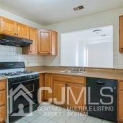 41 Rainford Road Edison, NJ 08820 - Photo 12 of 19 a kitchen with a stove and a cabinet