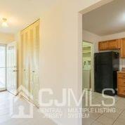 41 Rainford Road Edison, NJ 08820 - Photo 14 of 19 a bathroom with a granite countertop sink and a mirror