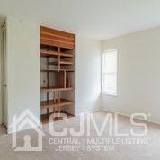 41 Rainford Road Edison, NJ 08820 - Photo 18 of 19 a view of wooden floor and windows in a room
