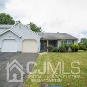41 Rainford Road Edison, NJ 08820 - Photo 4 of 19 a front view of a house with a yard