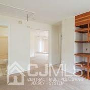 41 Rainford Road Edison, NJ 08820 - Photo 8 of 19 a view of a room with wooden floor and cabinet