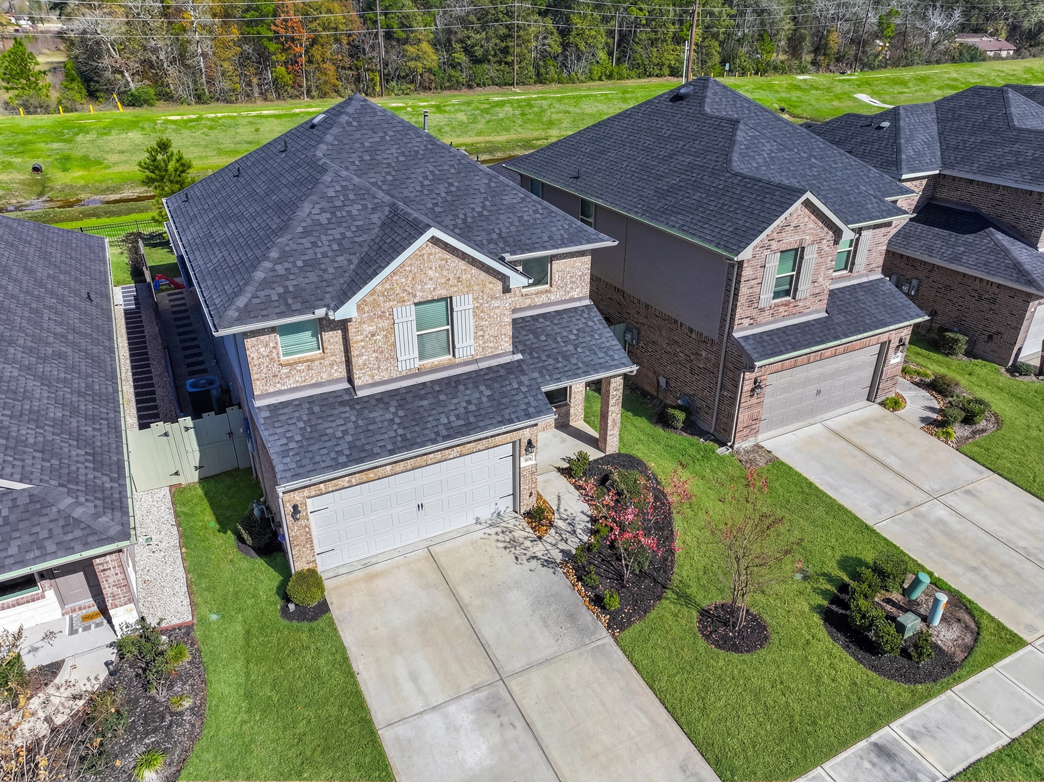 a aerial view of a house with a yard