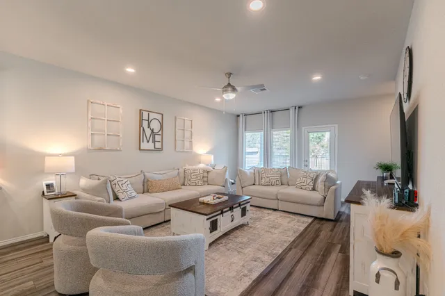 a living room with furniture and a large window