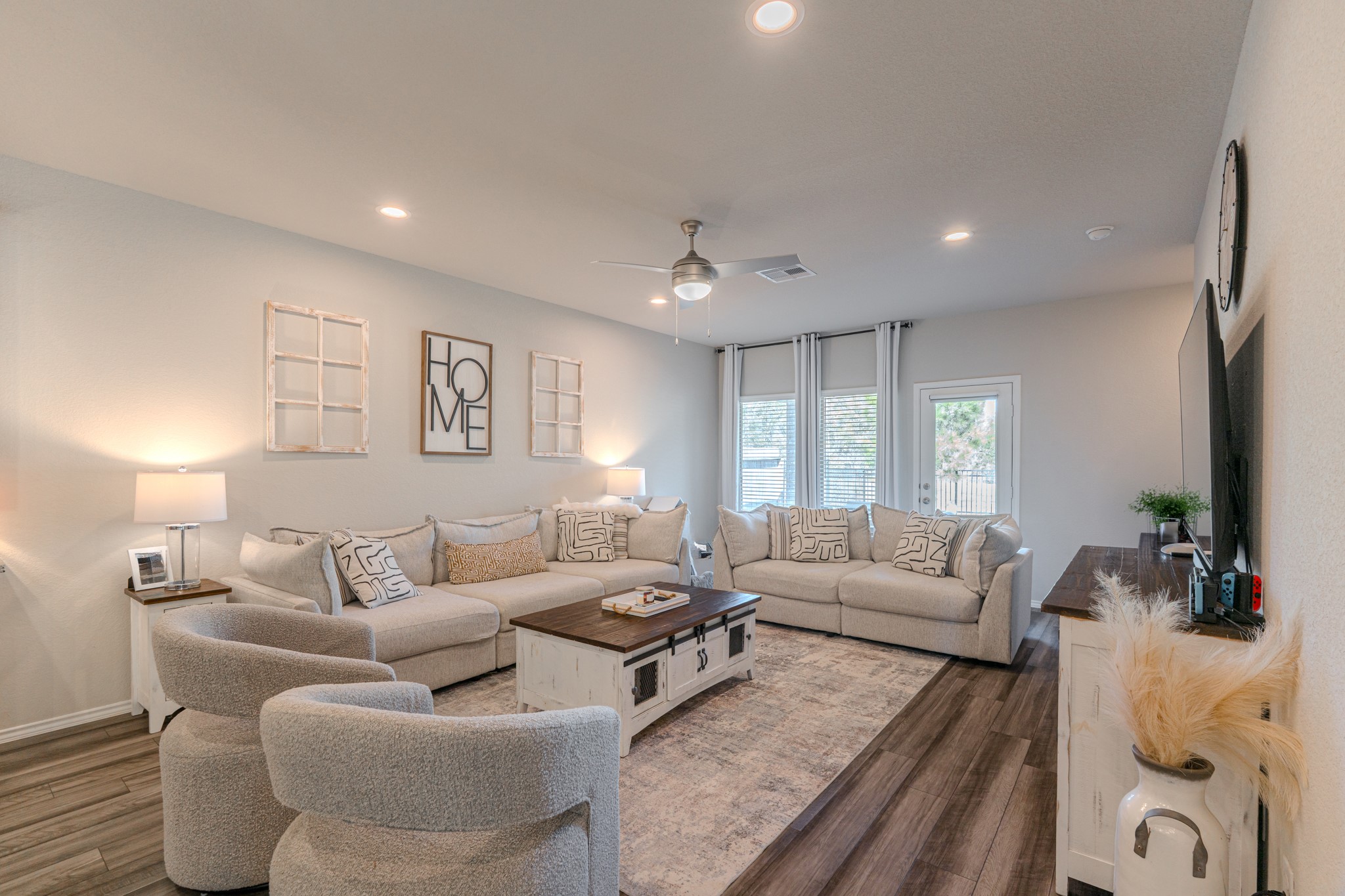 9221 Inland Leather Lane Conroe, TX 77385 - Photo 21 of 47 a living room with furniture and a large window