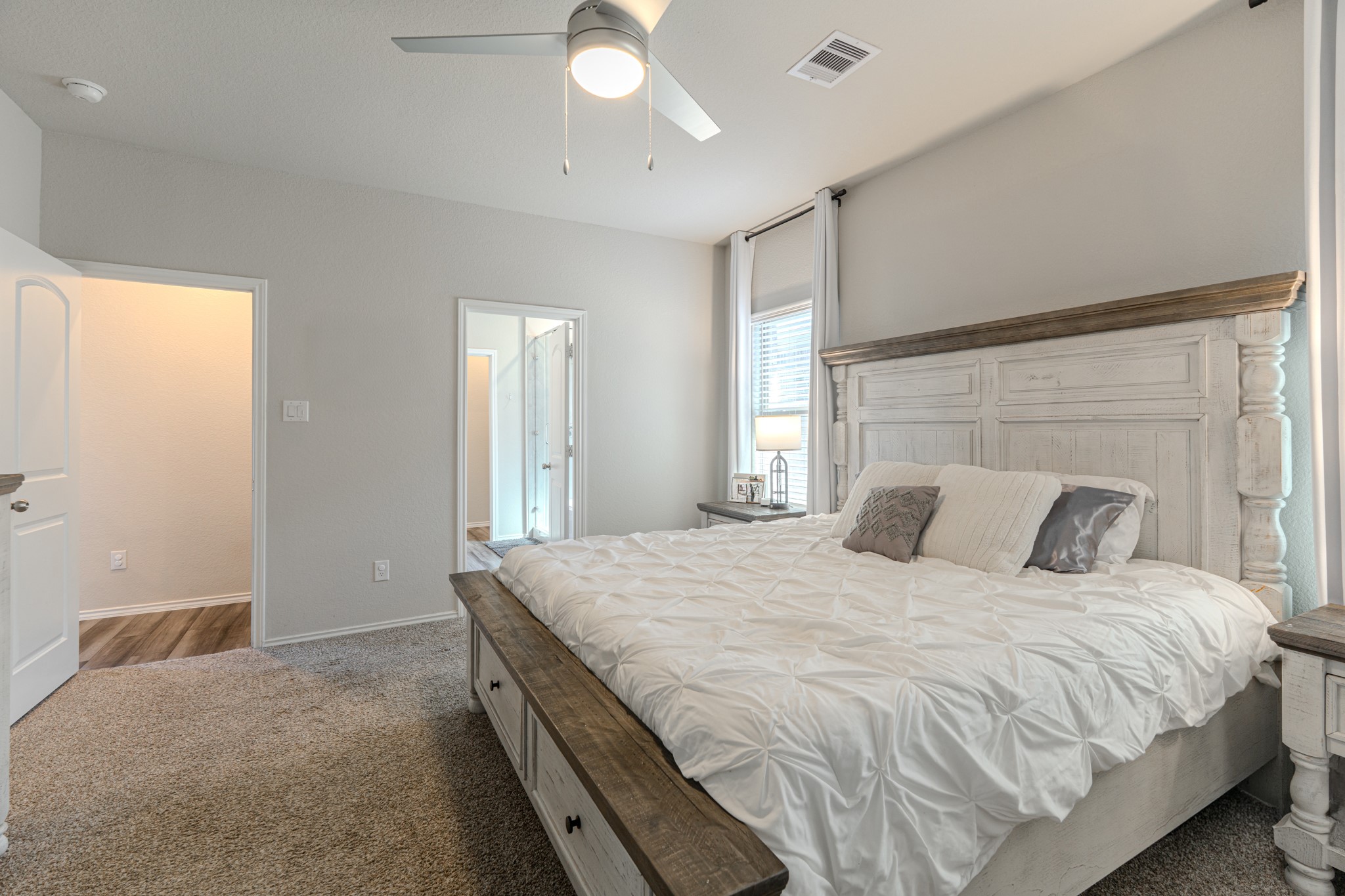 9221 Inland Leather Lane Conroe, TX 77385 - Photo 26 of 47 a bedroom with a bed and a night stand