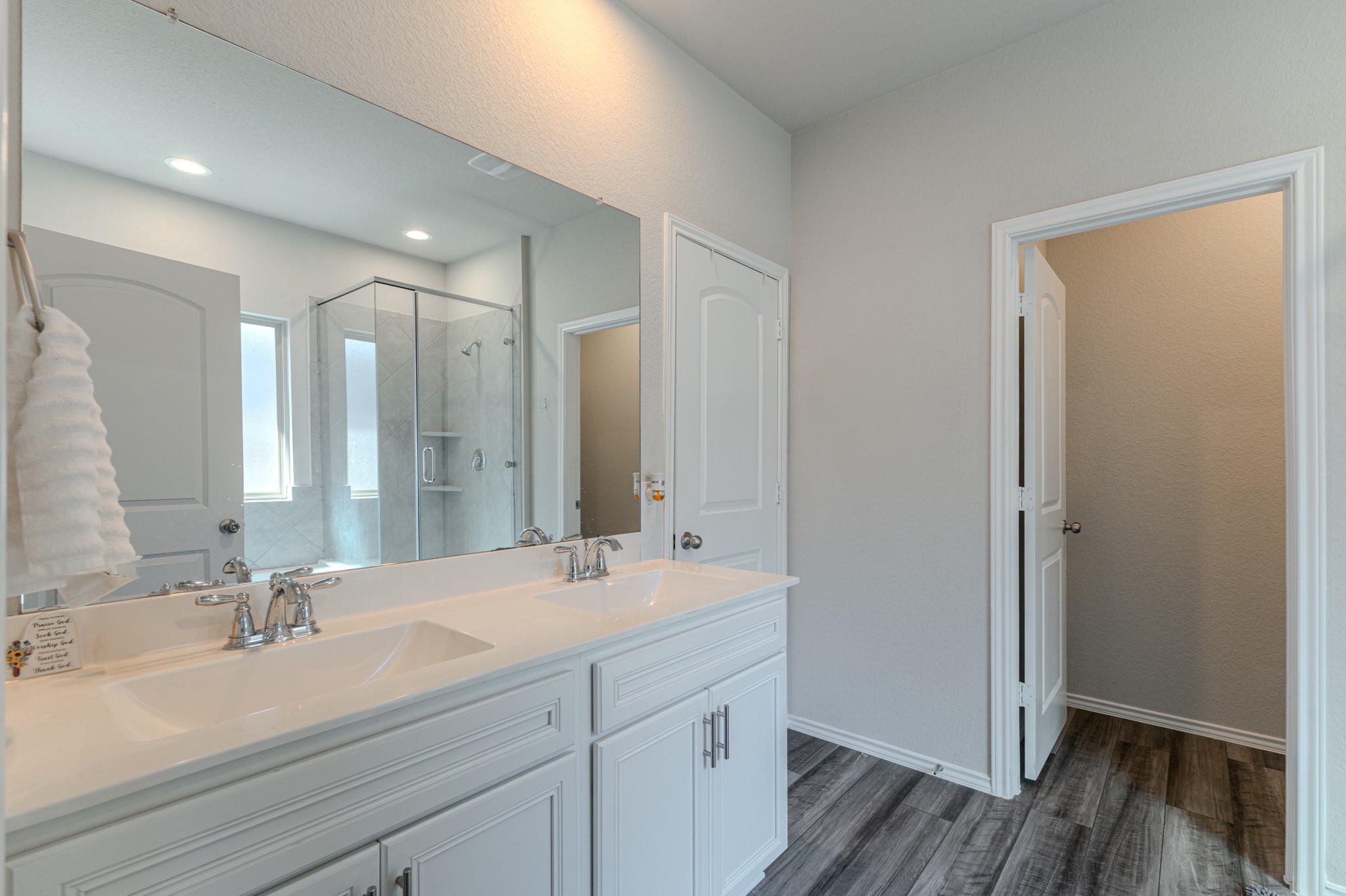 9221 Inland Leather Lane Conroe, TX 77385 - Photo 27 of 47 a bathroom with a sink double vanity granite tub and shower