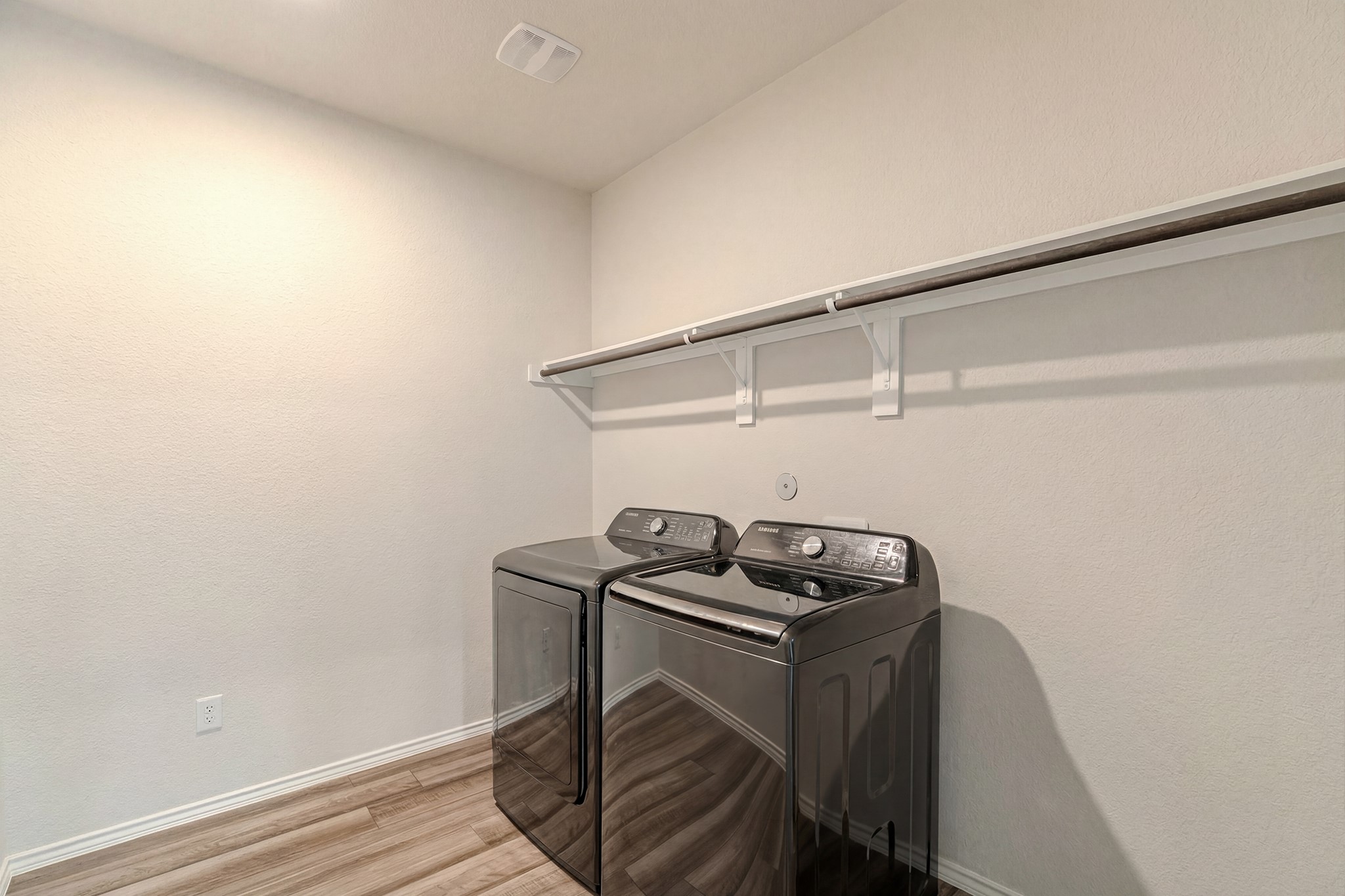 9221 Inland Leather Lane Conroe, TX 77385 - Photo 30 of 47 a utility room with dryer and washer