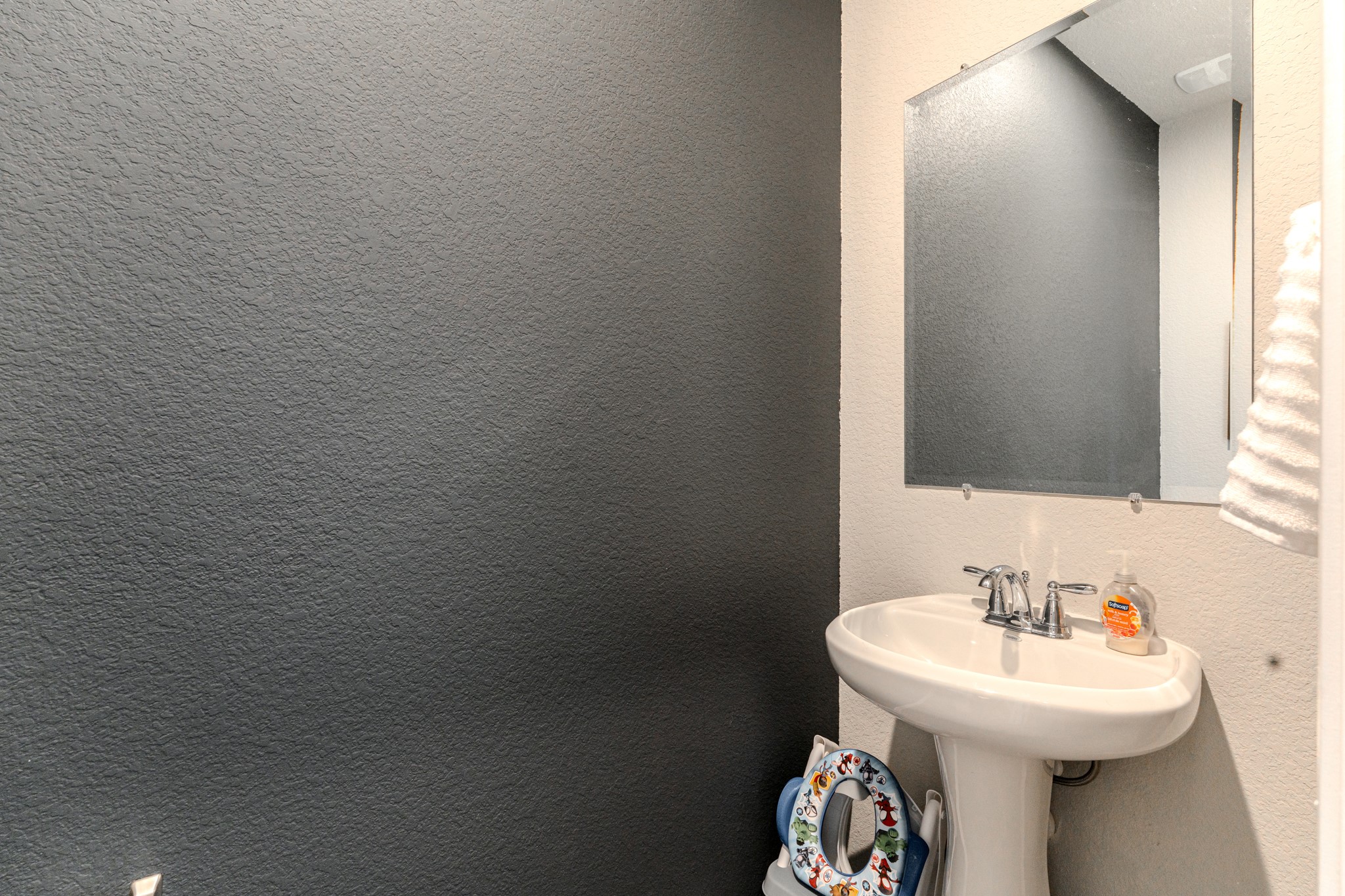 9221 Inland Leather Lane Conroe, TX 77385 - Photo 31 of 47 a bathroom with a sink toilet and a mirror