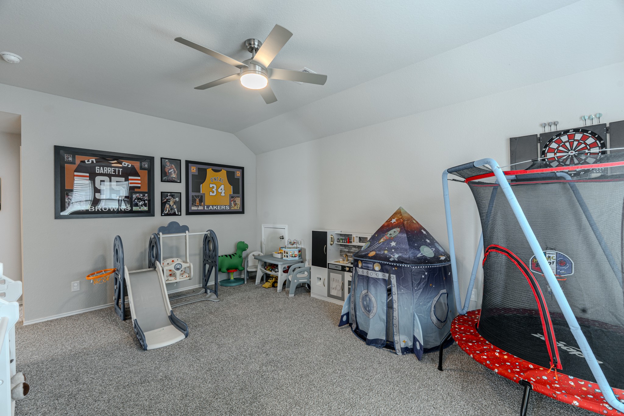 9221 Inland Leather Lane Conroe, TX 77385 - Photo 33 of 47 a living room with furniture and a flat screen tv
