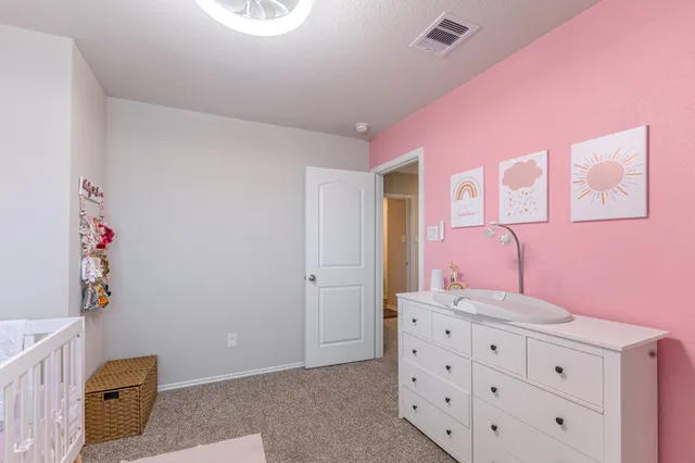a bathroom with a sink vanity and mirror