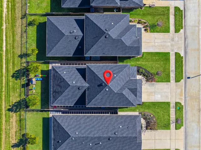 an aerial view of houses and roads