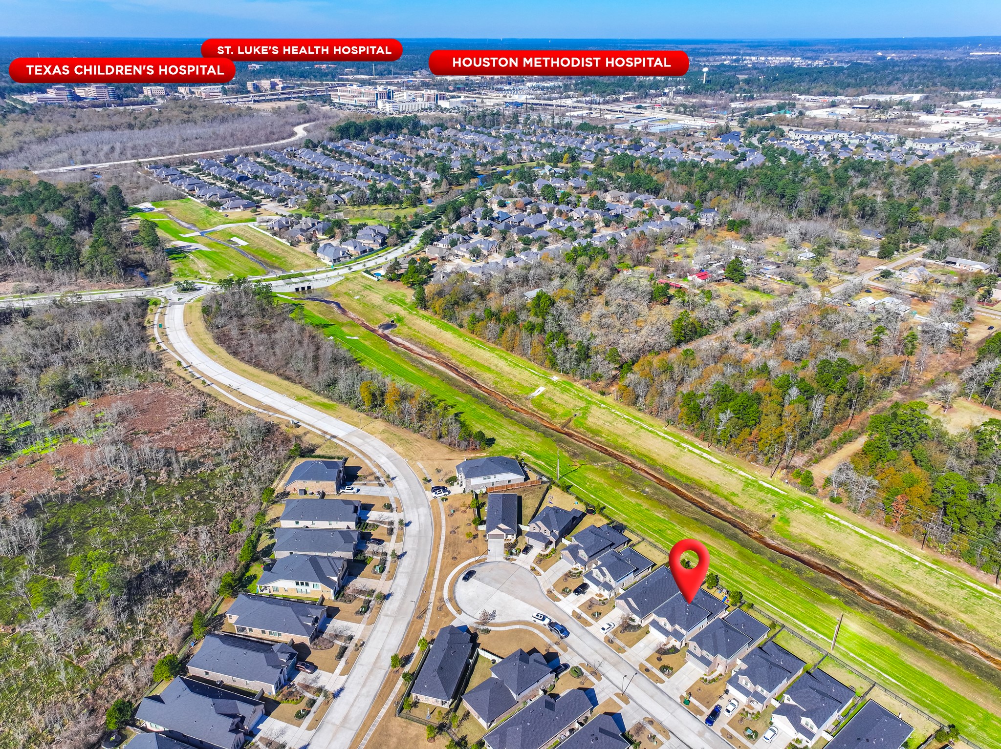 9221 Inland Leather Lane Conroe, TX 77385 - Photo 7 of 47 a view of a city with an outdoor space