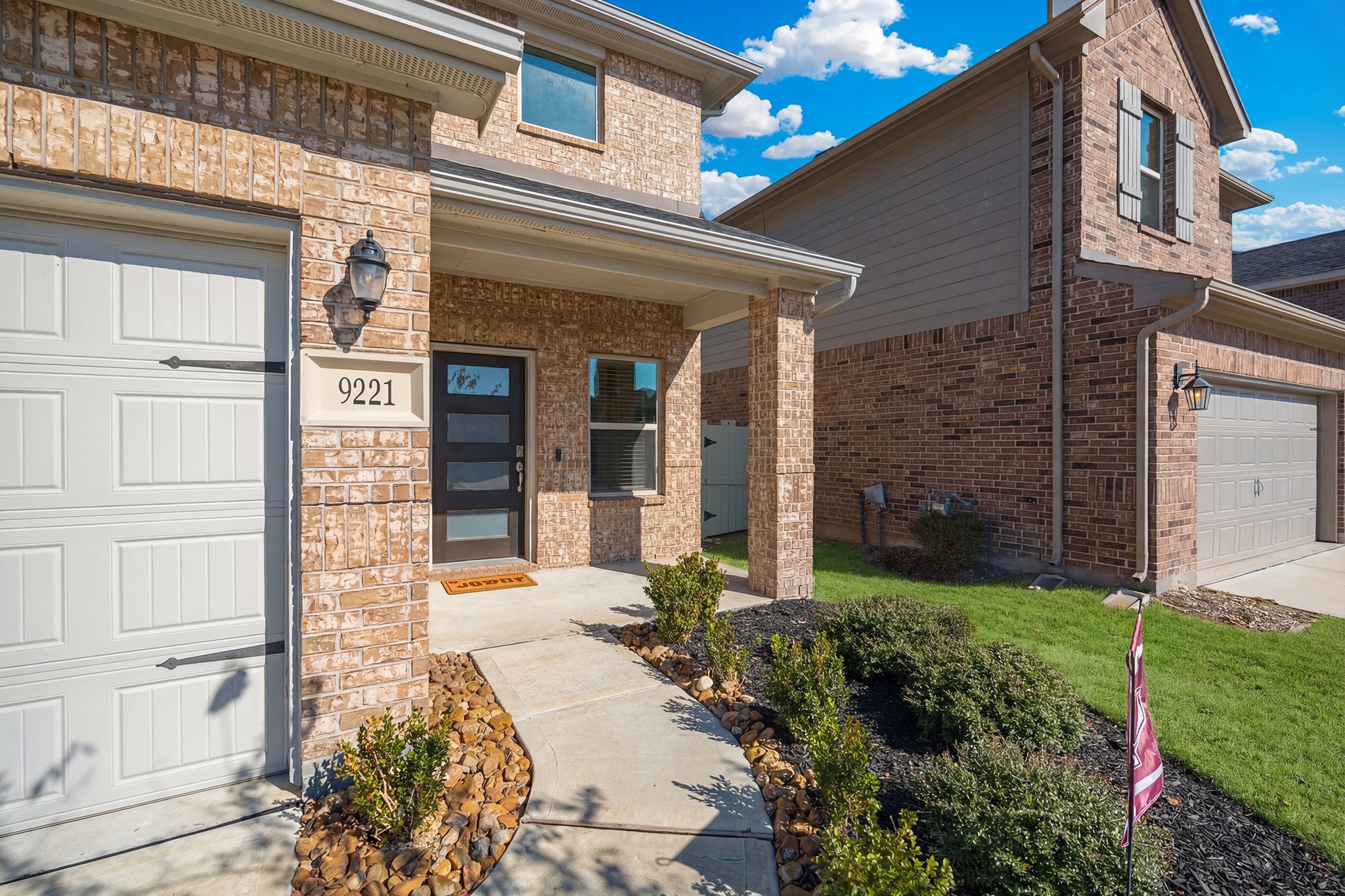 9221 Inland Leather Lane Conroe, TX 77385 - Photo 10 of 47 a front view of a house with garden