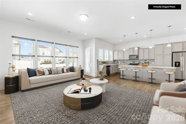 a living room with furniture and a large window