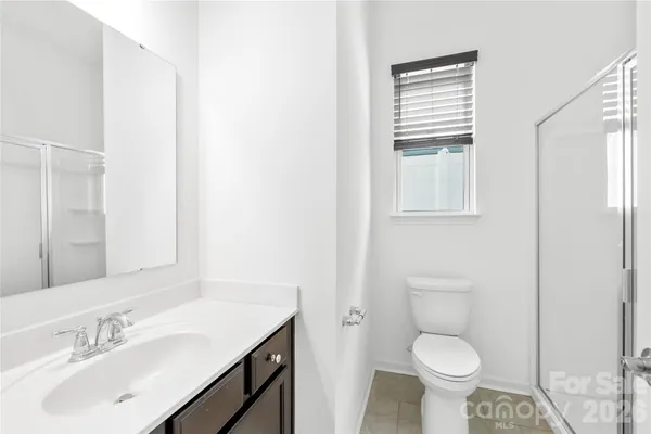 a bathroom with a sink toilet and vanity