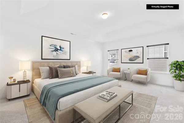 a bedroom with furniture and a couch