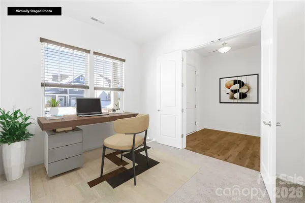 a workspace with furniture and window