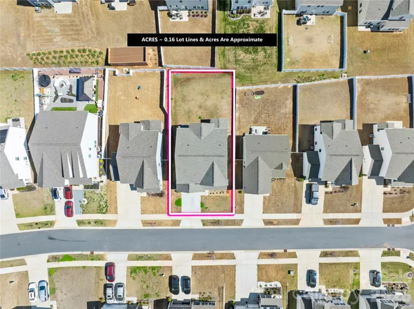 an aerial view of residential building with parking space