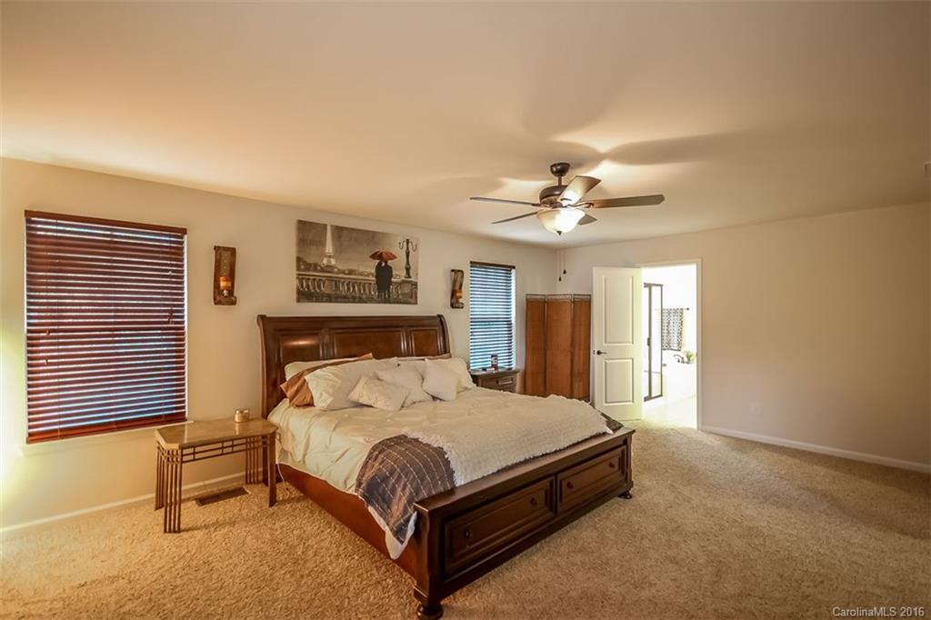 7700 West Berkeley Road Denver, NC 28037 - Photo 11 of 24 a bedroom with a bed and window