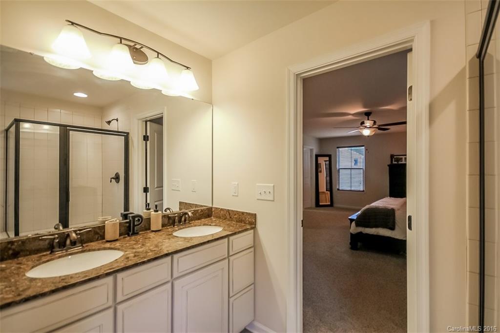 7700 West Berkeley Road Denver, NC 28037 - Photo 14 of 24 a en suite bathroom with a sink and a mirror