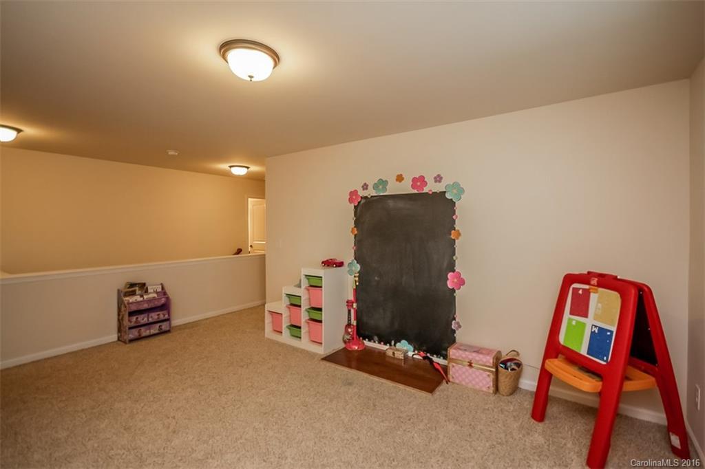 7700 West Berkeley Road Denver, NC 28037 - Photo 10 of 24 a room with toys and musical instruments