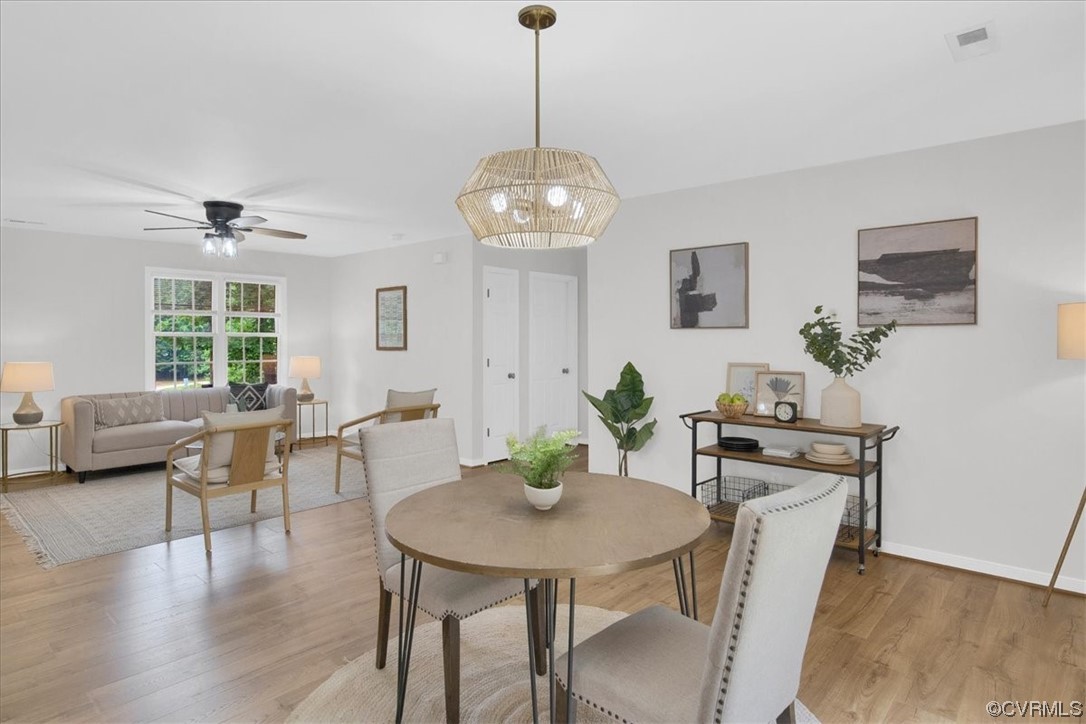 2020 Lone Ridge Drive Powhatan, VA 23139 - Photo 11 of 48 a view of a dining room with furniture window and wooden floor