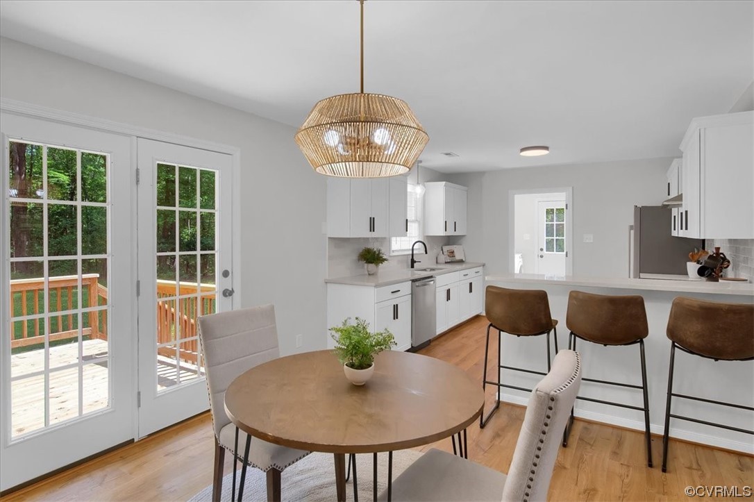 2020 Lone Ridge Drive Powhatan, VA 23139 - Photo 12 of 48 a view of a dining room with furniture window and wooden floor