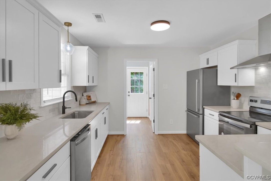 2020 Lone Ridge Drive Powhatan, VA 23139 - Photo 13 of 48 a kitchen with stainless steel appliances granite countertop a sink stove and refrigerator