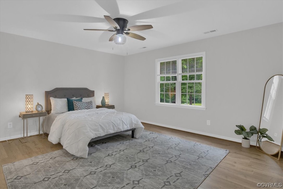 2020 Lone Ridge Drive Powhatan, VA 23139 - Photo 17 of 48 a spacious bedroom with a bed and window