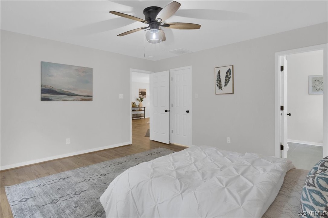 2020 Lone Ridge Drive Powhatan, VA 23139 - Photo 19 of 48 a bedroom with a large bed and a chandelier