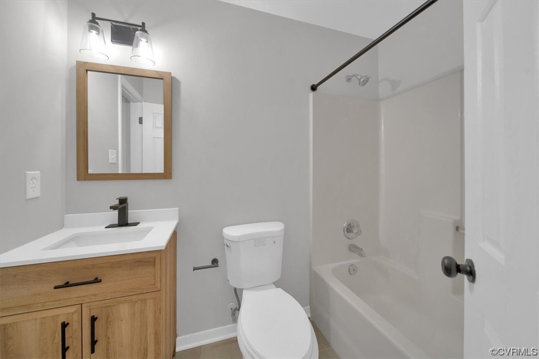 2020 Lone Ridge Drive Powhatan, VA 23139 - Photo 27 of 48 a bathroom with a toilet sink and mirror