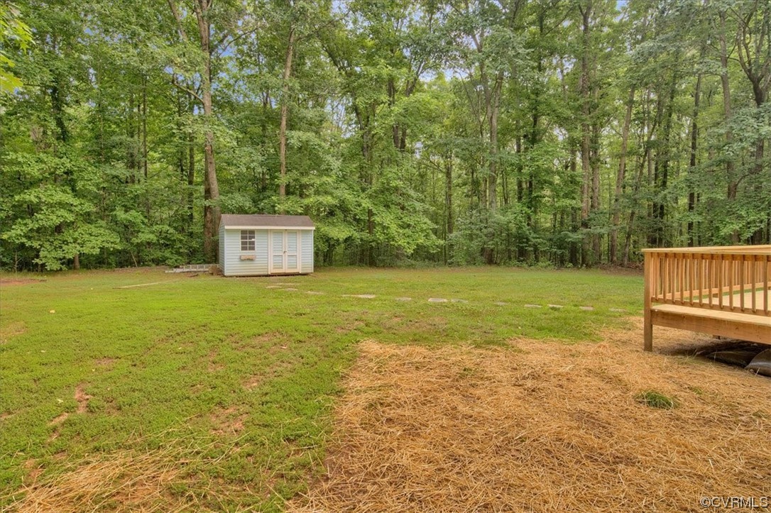 2020 Lone Ridge Drive Powhatan, VA 23139 - Photo 34 of 48 a view of a yard with a house and a bench