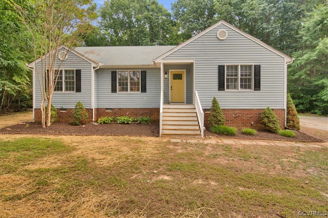 2020 Lone Ridge Drive Powhatan, VA 23139 - Photo 36 of 48 a view of a white house next to a yard with wooden fence