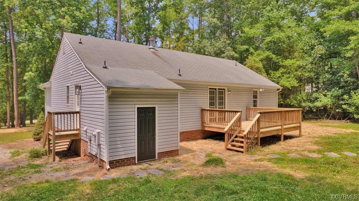 2020 Lone Ridge Drive Powhatan, VA 23139 - Photo 42 of 48 a view of a house with a yard chairs and a patio