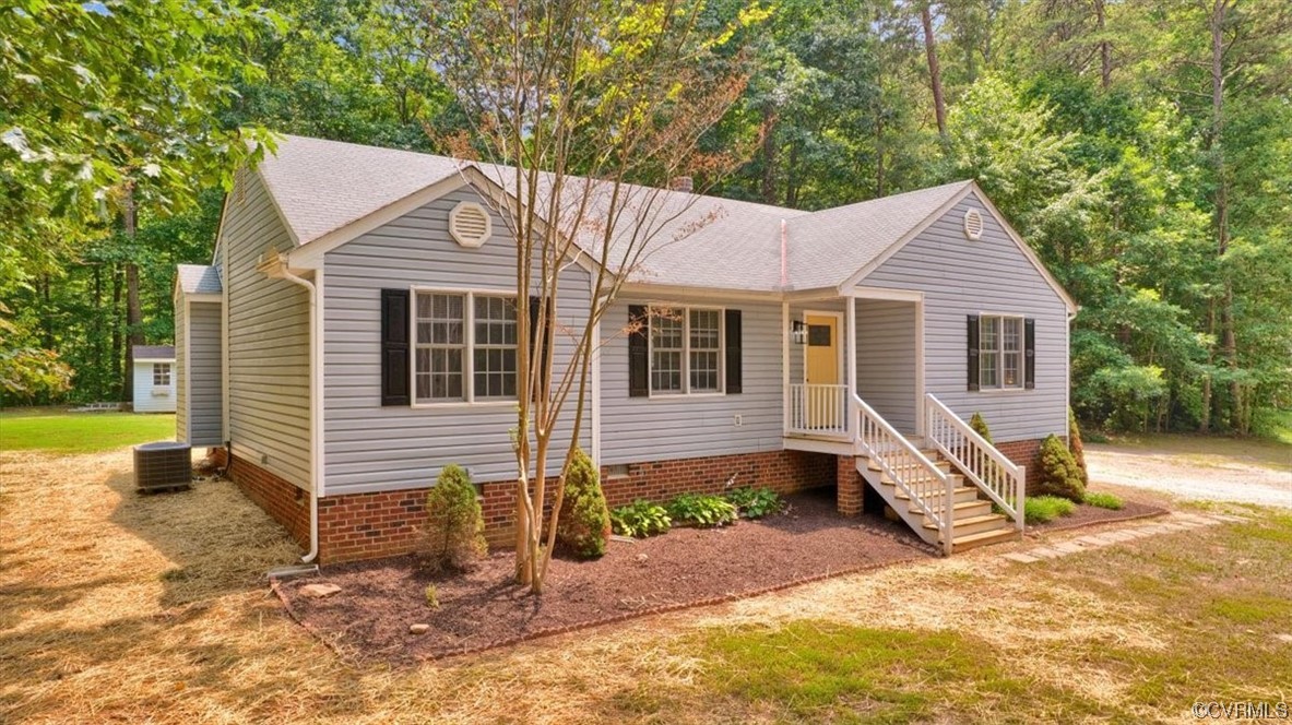 2020 Lone Ridge Drive Powhatan, VA 23139 - Photo 45 of 48 a view of a house with a yard chairs and floor to ceiling window