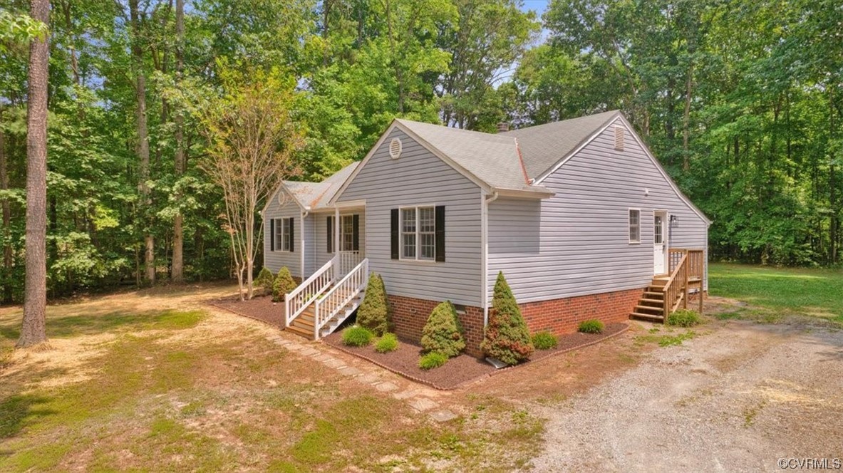 2020 Lone Ridge Drive Powhatan, VA 23139 - Photo 46 of 48 a front view of a house with a yard and garage