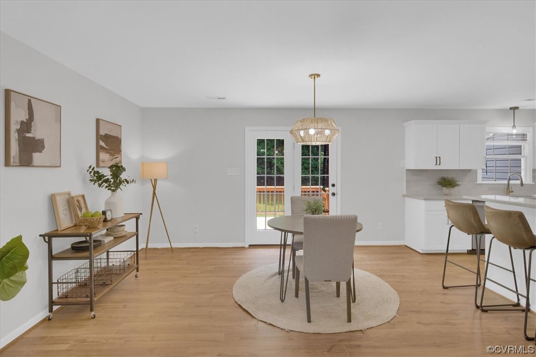 2020 Lone Ridge Drive Powhatan, VA 23139 - Photo 7 of 48 a view of a dining room with furniture window and wooden floor
