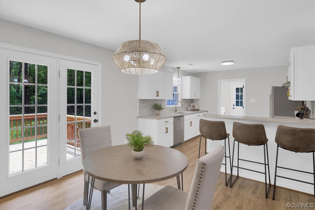 2020 Lone Ridge Drive Powhatan, VA 23139 - Photo 9 of 48 a view of a dining room with furniture wooden floor and chandelier
