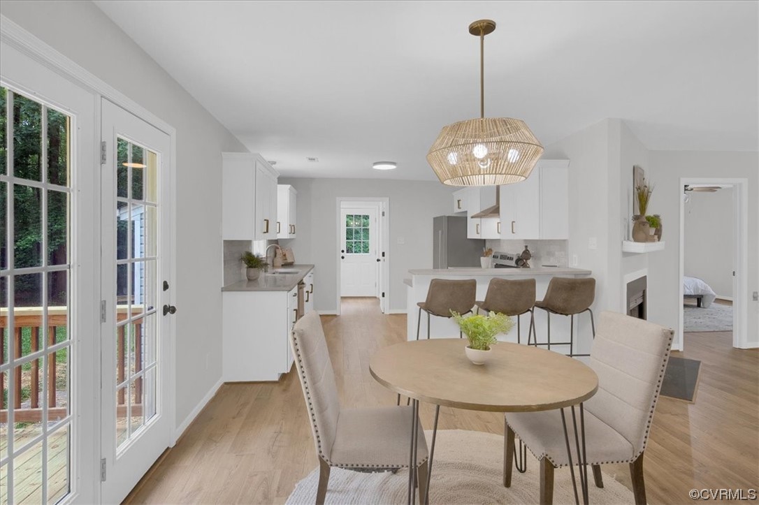 2020 Lone Ridge Drive Powhatan, VA 23139 - Photo 10 of 48 a view of a dining room with furniture and wooden floor