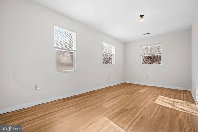 a bedroom with bed and a couch