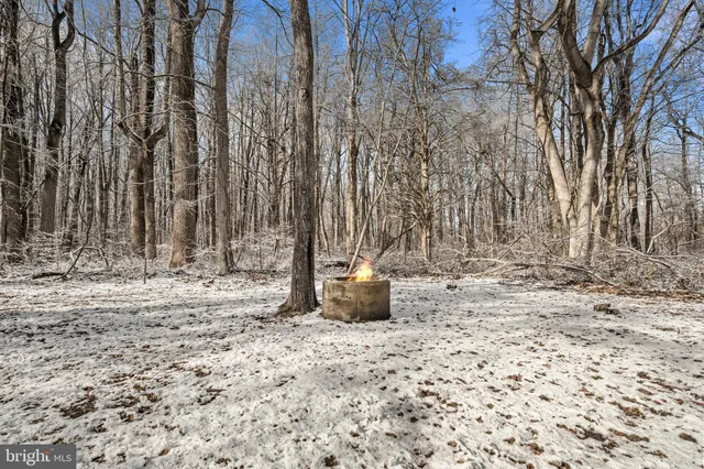 a view of a house with a wooden deck