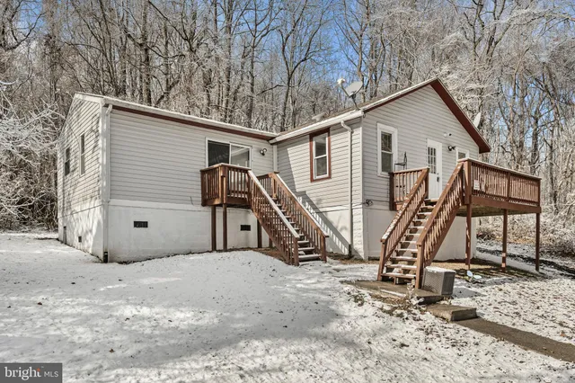 a view of balcony with wooden fence