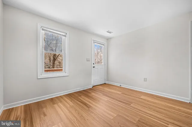 a living room with furniture a rug and a table