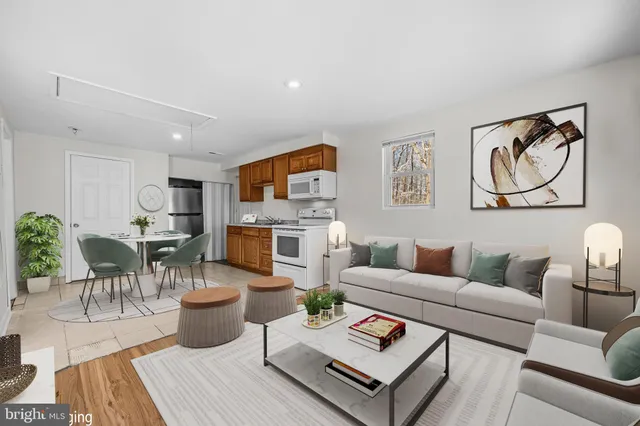 a view of kitchen with wooden floor electronic appliances and window